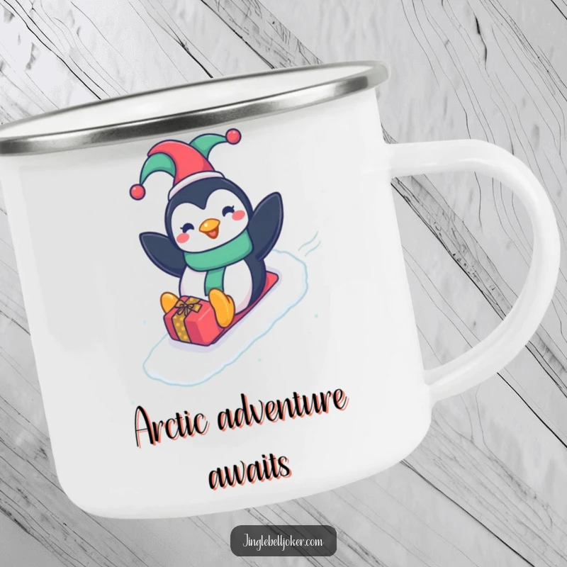 Funny Penguin Jester Camping Mug, a happy penguin in a jester hat sliding down a gift-wrapped slope, for humorous adventures.