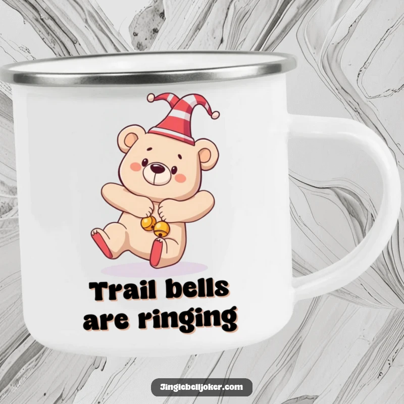 Funny enamel camping mug with a bear in a jester hat and bells, humorously tripping during a festive outdoor scene.