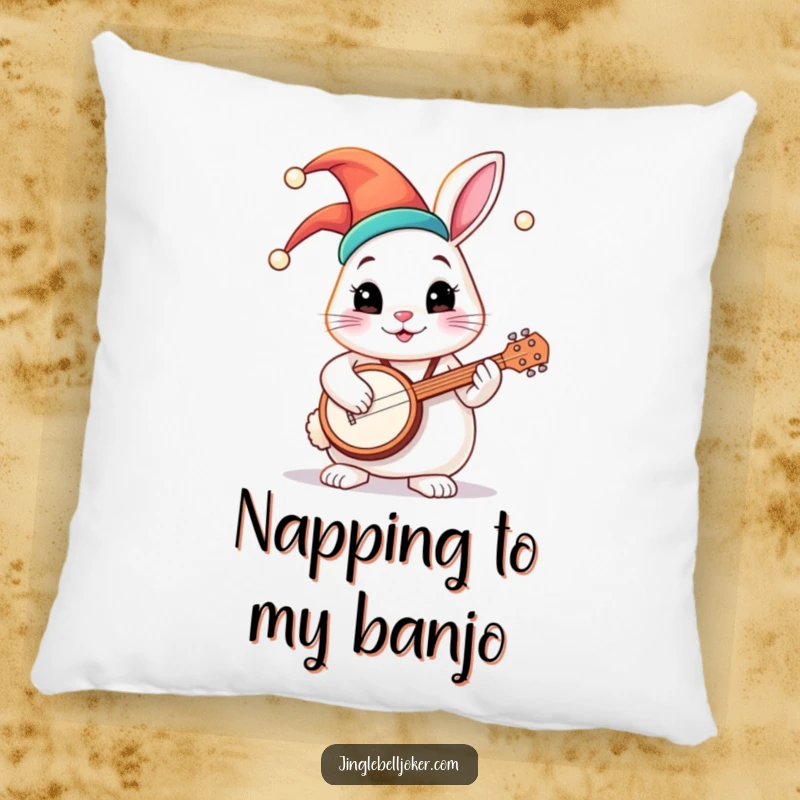 Funny pillow featuring a round bunny character in a colorful jester hat, strumming a tiny banjo with a happy, contented expression.