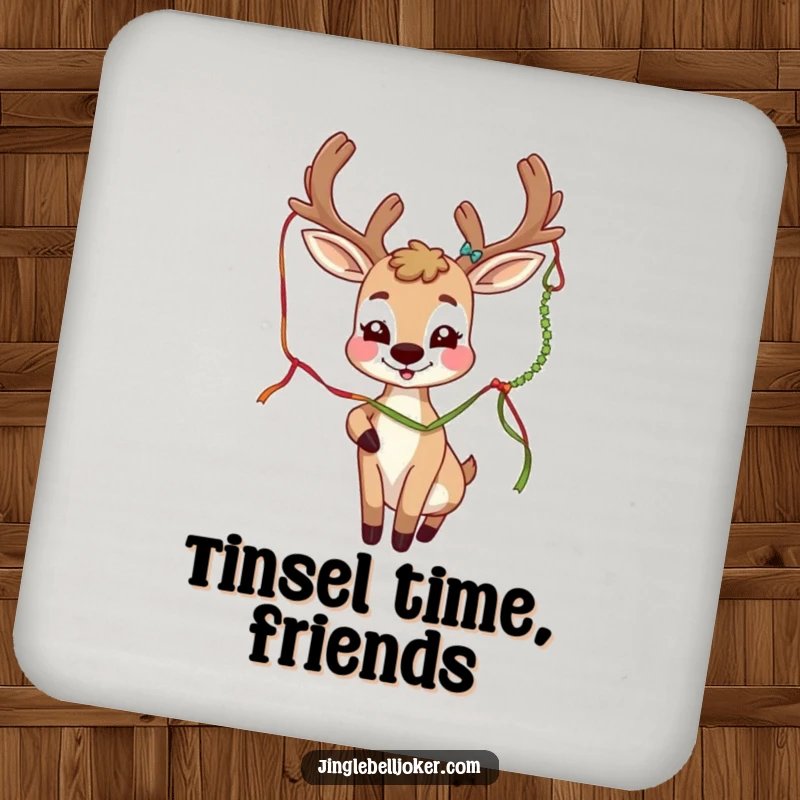 Funny deer joker character with festive antlers playfully batting a tinsel strand, printed on a protective drink coaster.