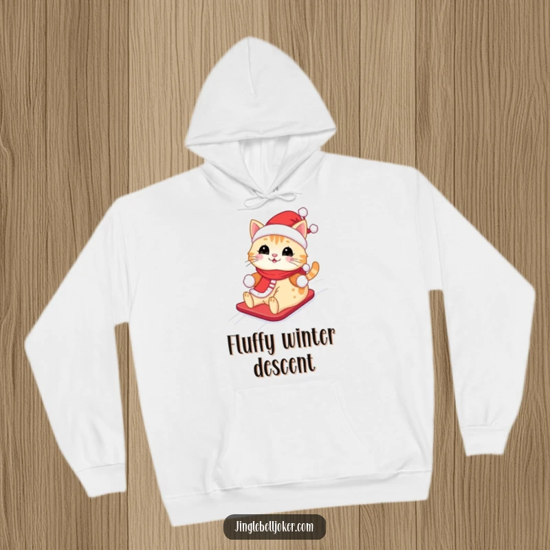 Funny Kawaii Santa Cat Hoodie: A cute cat dressed as Santa, happily sliding down a snowy hill, perfect for cold weather.