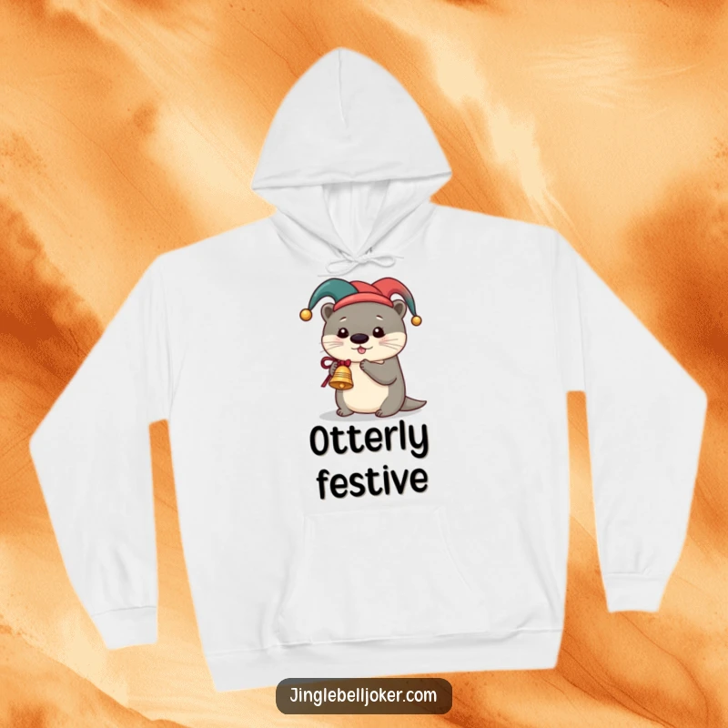 Funny Otter Jester Hoodie, a cute otter in a jester hat ringing a miniature sleigh bell, perfect for cozy and humorous festive wear.