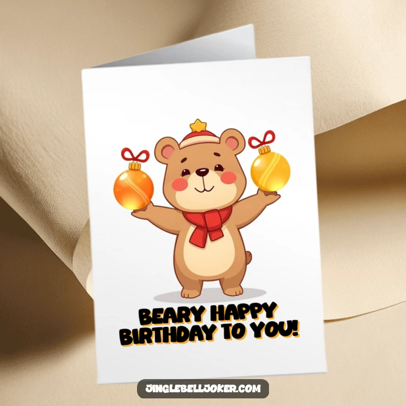 Funny Free Printable Birthday Card: A smug happy bear character skillfully juggles three glowing Christmas baubles with impressive confidence.